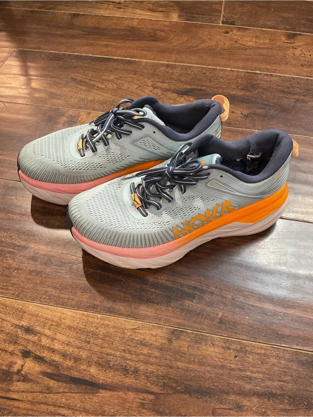 Hoka Blue Athletic Shoes with Orange and Pink Accents
